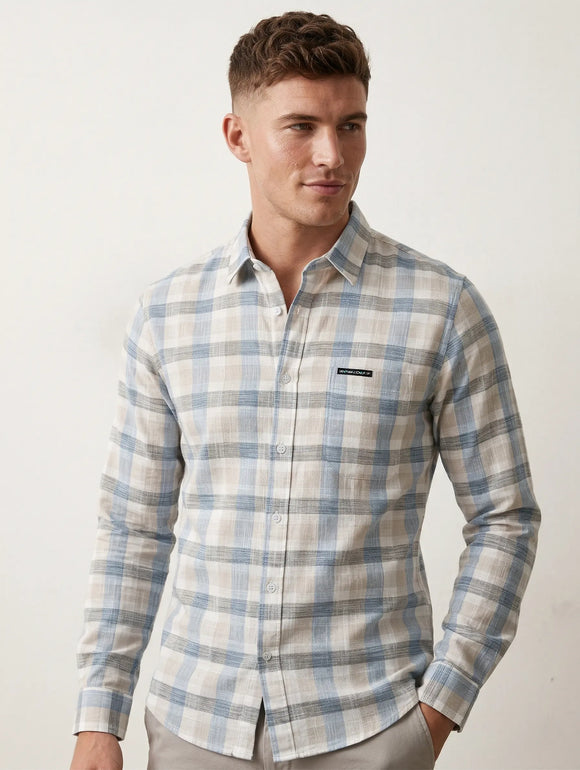Camisa gris de manga larga para hombre con cuadros azul claro, bolsillo frontal con etiqueta de marca Sherman Morgan.