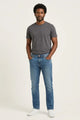 Jeans de mezclilla para hombre en lavado bleach corte slim fit, pantalón azul con efecto desgastado natural, Sherman Morgan.
