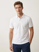 Playera tipo polo hombre blanca piqué botones de presión filo tonal cuello mangas slim fit Sherman Morgan.
