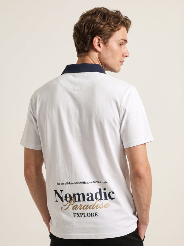 Polo oversize gris, bordado Nomadic Paradise en espalda baja
