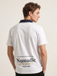 Polo oversize gris, bordado Nomadic Paradise en espalda baja